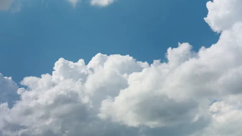 White cumulus clouds transforming into dark heavy storm clouds in blue sky Video stock 340039797