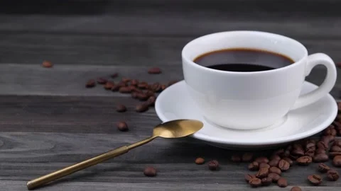 White cup with black coffee on a dark wooden background Stock Footage 197435722