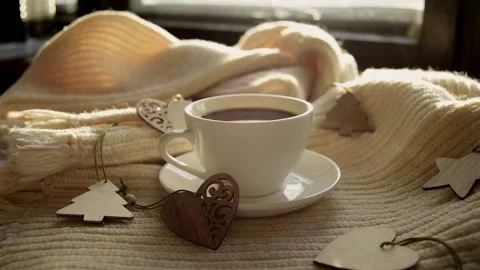 White cup of black coffee warm light scarf with wooden Christmas decorations Stock Footage 220060855