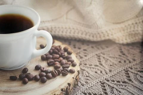 White cup of black hot coffee drink and coffee beans Stock Photos