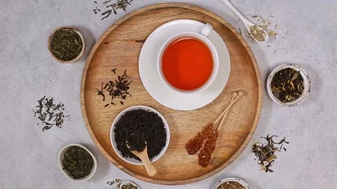 White cup of black tea, dried black tea and sugar. Dried various kinds of tea Stock Footage 204158843