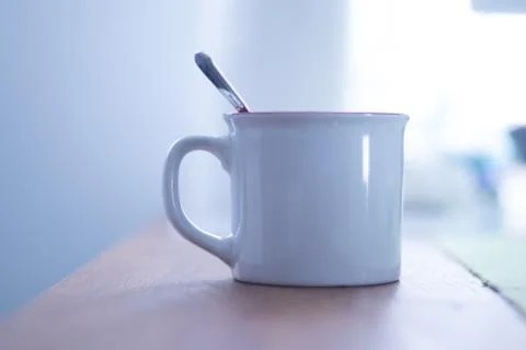 White cup of breakfast on the table Stock Photos