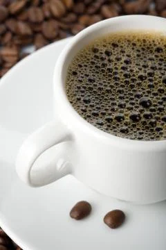 White cup of coffee and roasted beans 写真素材