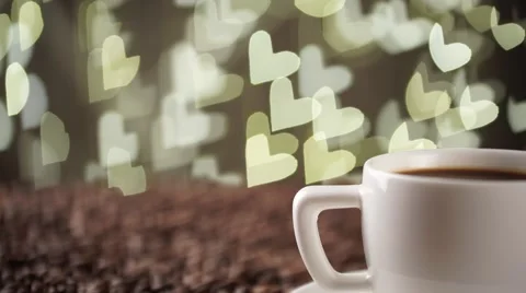 White cup on the coffee beans on the background of hearts Stock Footage 56424771