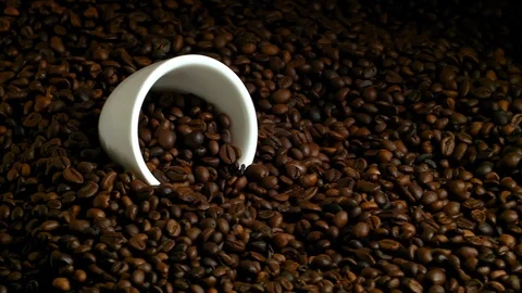 White cup with coffee beans, fried coffee beans on burlap Stock Footage 85594886