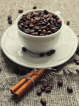 White cup of coffee beans Stock Photos