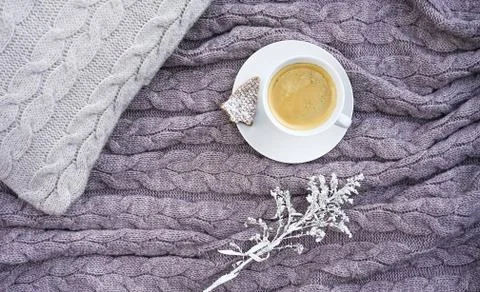 White cup coffee with cookie in form fir and nice white flower on pillow and 스톡 사진
