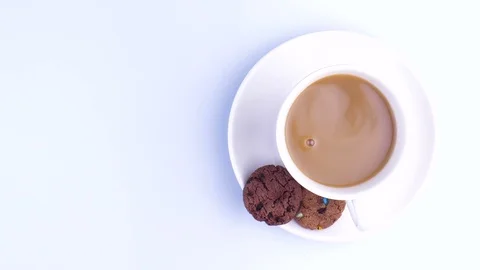 A white cup of coffee on the table Stock Footage 124621720