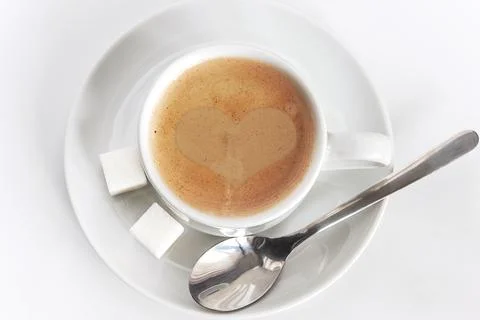 White cup of coffee on a white background top view Stock Photos