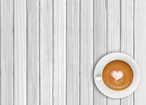 White cup of coffee on wooden background 写真素材