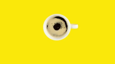 White cup of coffee on yellow background. Stop motion looping animation. Stock Footage 178786602