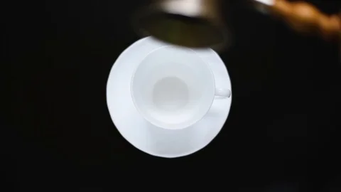 White Cup on a dark table with poured coffee Stock Footage 95393566
