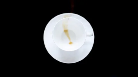 White Cup on a dark table with poured coffee Stock Footage 95393675