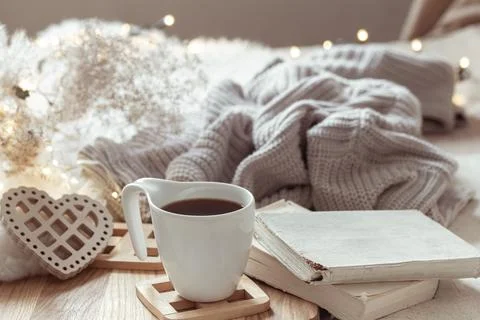 White cup with drink on blurred background home decor. Stock Photos