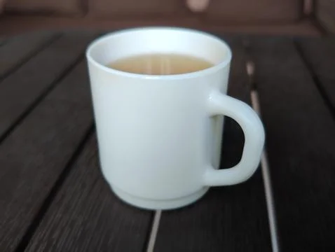 White cup with a drink Stock Photos
