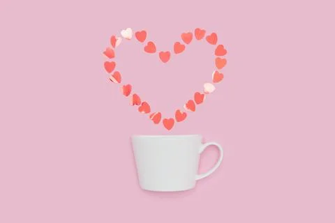 White Cup with Floating Heart Shape on Pink Background Foto stock