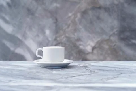 White cup front view on marble background Stock Photos