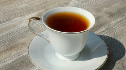 White cup of hot black tea Stock Footage 62528141