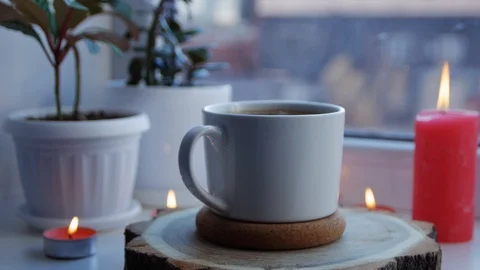 White cup of hot coffee on the windowsill. Copy space. Stock Footage 106196993