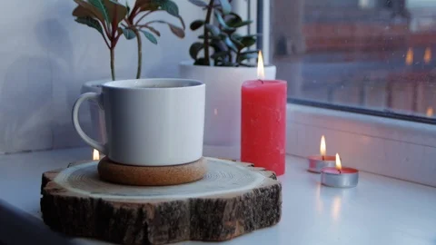 White cup of hot coffee on the windowsill. Copy space. Vídeo Stock 106196994