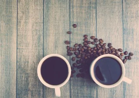 White Cup of hot coffee on a wooden table Фото