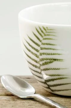 White cup with leaf printed Stock Photos