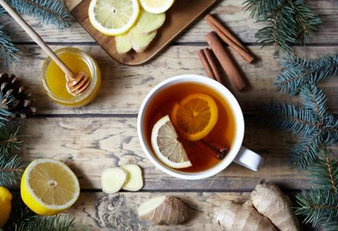 White cup of natural tea with ginger, lemon and honey. Healthy drink. Hot winter Stock Photos