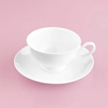 White cup on pink background solid Stock Photos