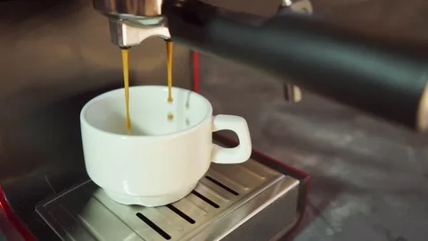 White Cup in a red coffee machine. Stock-Footage 124628075