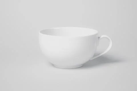 A white cup sits on a white background Foto stock