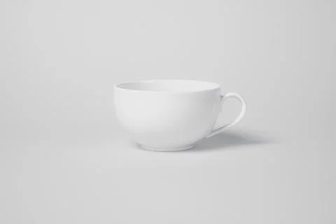 A white cup sits on a white background Stock Photos