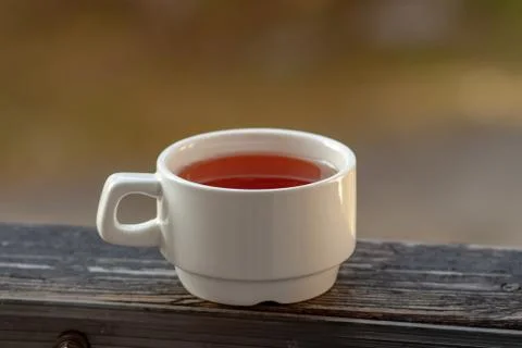 A white Cup stands with tea Stock Photos