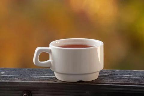 A white Cup stands with tea Stock Photos
