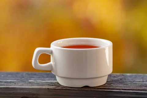 A white Cup stands with tea Stock Photos