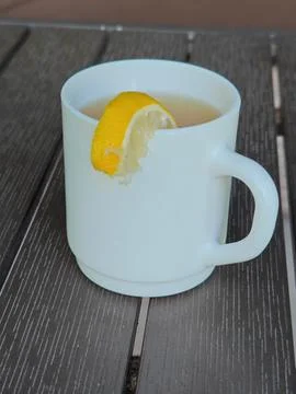 White cup of tea on the table Stock Photos