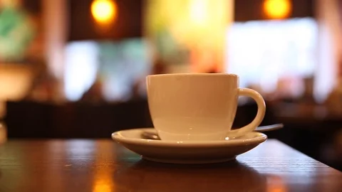 White cup of tea on the table in a restaurant Stock Footage 106805359