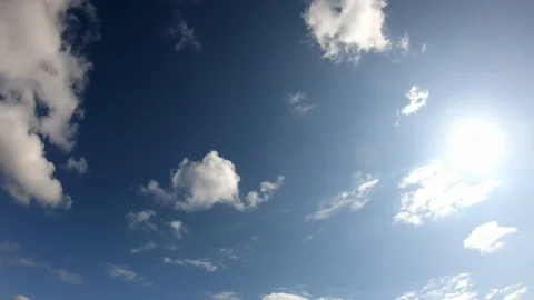 White curly clouds slowly flyes in the sky in a sunny day in autumn in Munich Stock Footage 119772629
