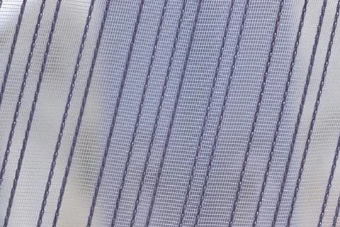 White curtain with delicate texture pattern in home setting. Stock-Fotos