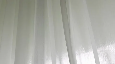 White curtain with sunlight through the window the cozy bedroom in early morn Stock Footage 220734032