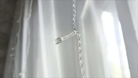 White curtains and tulle on the window and the garland turned off Stock Footage 313265462