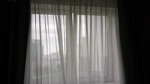 White curtains waved by light wind in dark room in morning Video stock 135859484
