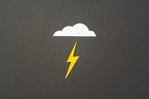 White cut out paper cloud and yellow lightning on black Stock Photos