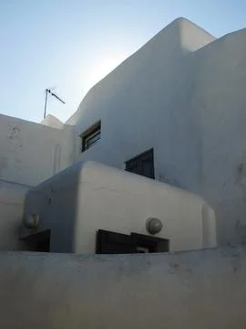 White cycladic architecture building facade with antenna Stock Photos