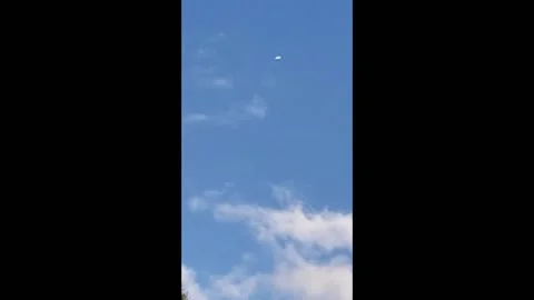 White Cylindrical Object Spotted in the Clouds, Wixom, Michigan, USA - 25 Sep 20 Video stock 205141344