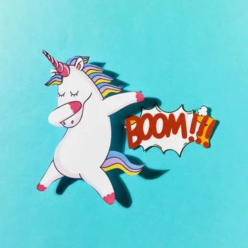 White dabbing unicorn with boom comic text blue backdrop. High quality and Stock Illustration