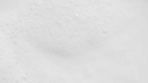 White dairy smooth foam on top of milk, foamed milk, steamed milk Stock Footage 201351294
