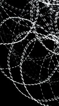 White dashed lines of lights on a black background Stock Photos