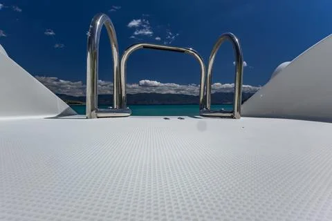 White deck of the boat with railing and access to the sea, Stock Photos