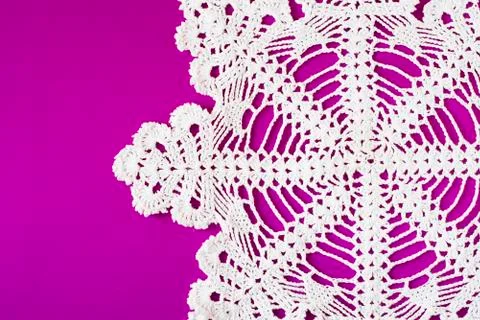 White decorative serviette on purple background Stock Photos