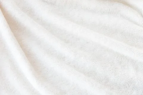 White delicate soft  background of plush fabric Stock Photos